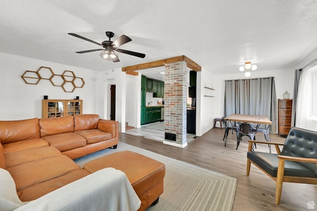2890 Wheelock Ave, Ogden, UT 84403 - living area with ceiling fan, light wood-style floors, and a textured ceiling