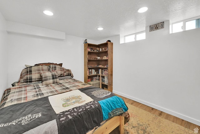 2890 Wheelock Ave, Ogden, UT 84403 - bedroom featuring wood finished floors, baseboards, recessed lighting, and a textured ceiling