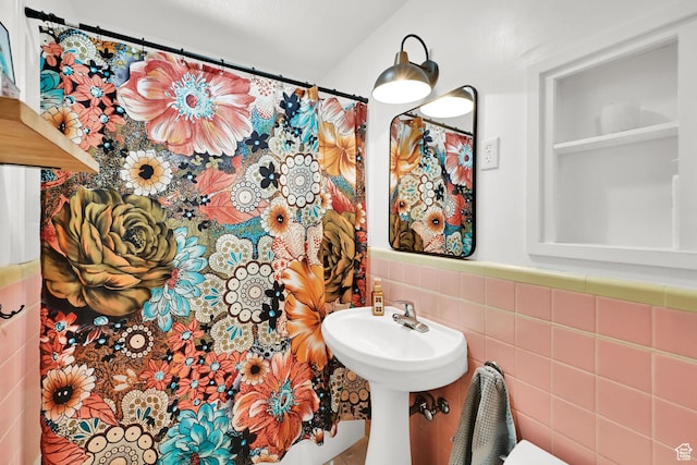 2890 Wheelock Ave, Ogden, UT 84403 - bathroom featuring tile walls and a sink