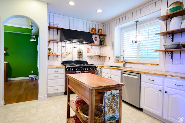 2763 N Hills Dr, Layton, UT 84040 - kitchen with open shelves, butcher block counters, dishwasher, exhaust hood, and a sink
