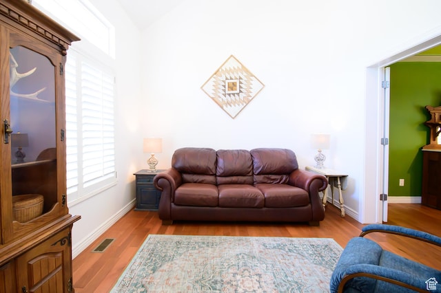 2763 N Hills Dr, Layton, UT 84040 - living area featuring plenty of natural light, wood finished floors, and baseboards