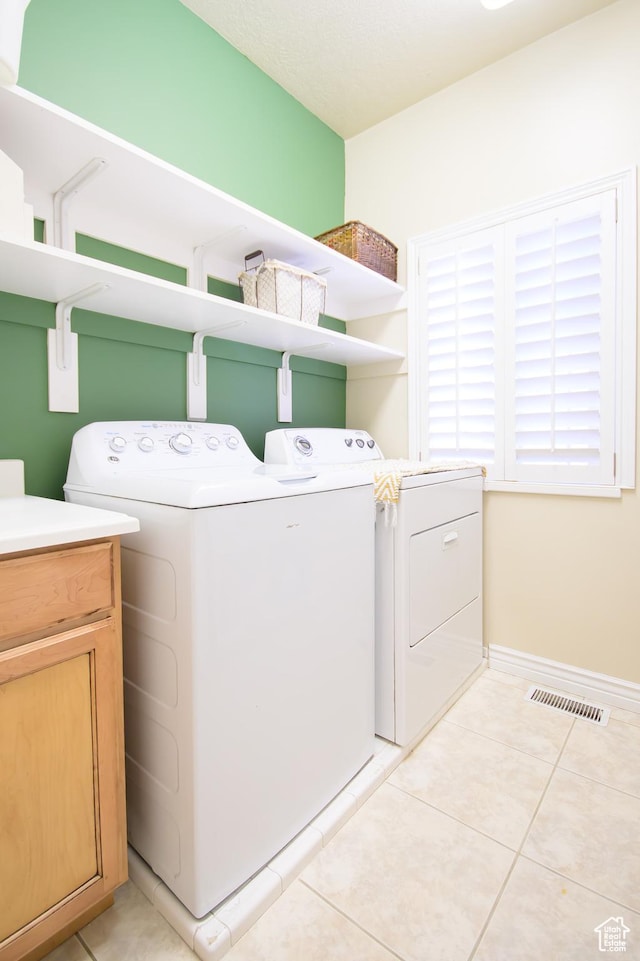 2763 N Hills Dr, Layton, UT 84040 - washroom with independent washer and dryer, light tile patterned floors, and baseboards