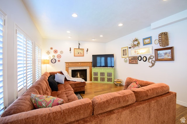 2763 N Hills Dr, Layton, UT 84040 - living room with wood finished floors, recessed lighting, baseboards, and a lit fireplace