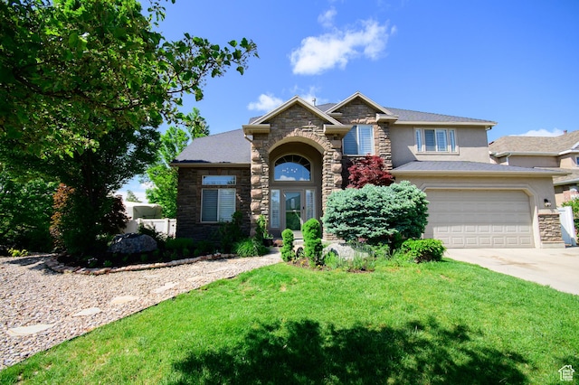 2763 N Hills Dr, Layton, UT 84040 - view of front of home featuring stone siding, driveway, stucco siding, a front yard, and a garage