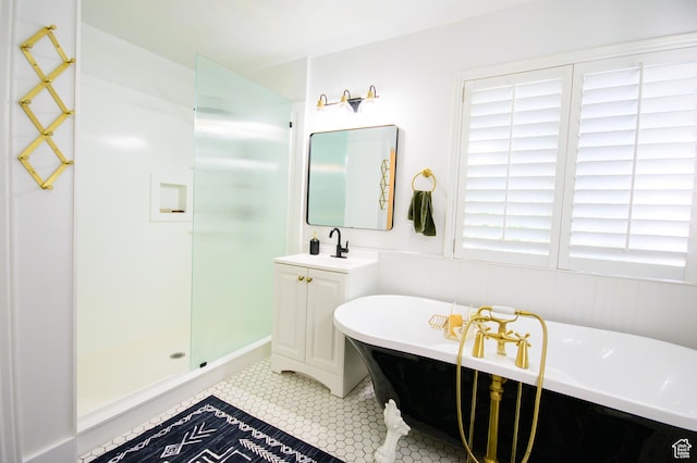 2763 N Hills Dr, Layton, UT 84040 - full bathroom featuring a stall shower, a soaking tub, vanity, and tile patterned floors