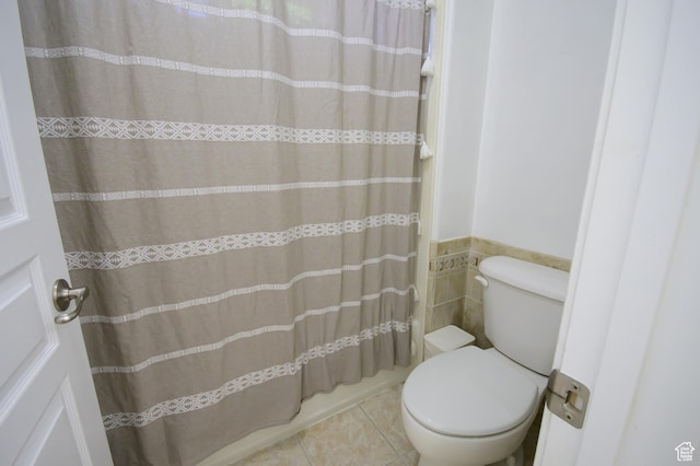 2763 N Hills Dr, Layton, UT 84040 - full bathroom with toilet, tile walls, tile patterned flooring, wainscoting, and a shower with shower curtain