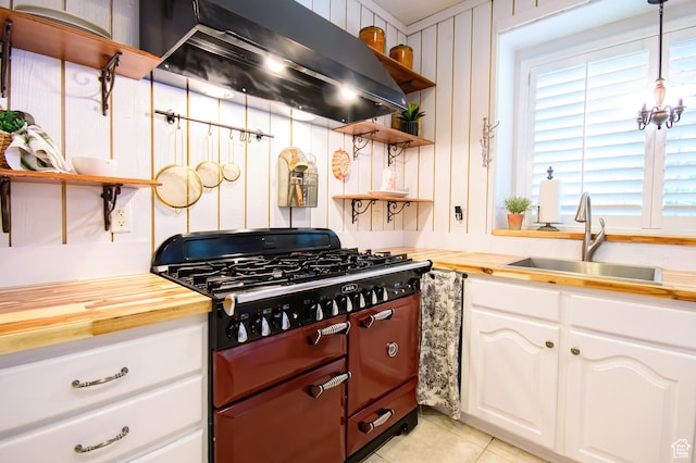 2763 N Hills Dr, Layton, UT 84040 - kitchen featuring open shelves, extractor fan, range with two ovens, wooden counters, and a sink