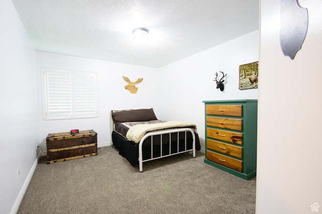 2763 N Hills Dr, Layton, UT 84040 - carpeted bedroom with baseboards and a textured ceiling