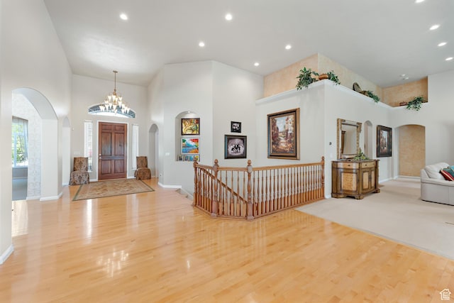 531 W Glendon Way, Pleasant Grove, UT 84062 - entryway with a towering ceiling, arched walkways, wood finished floors, recessed lighting, and baseboards