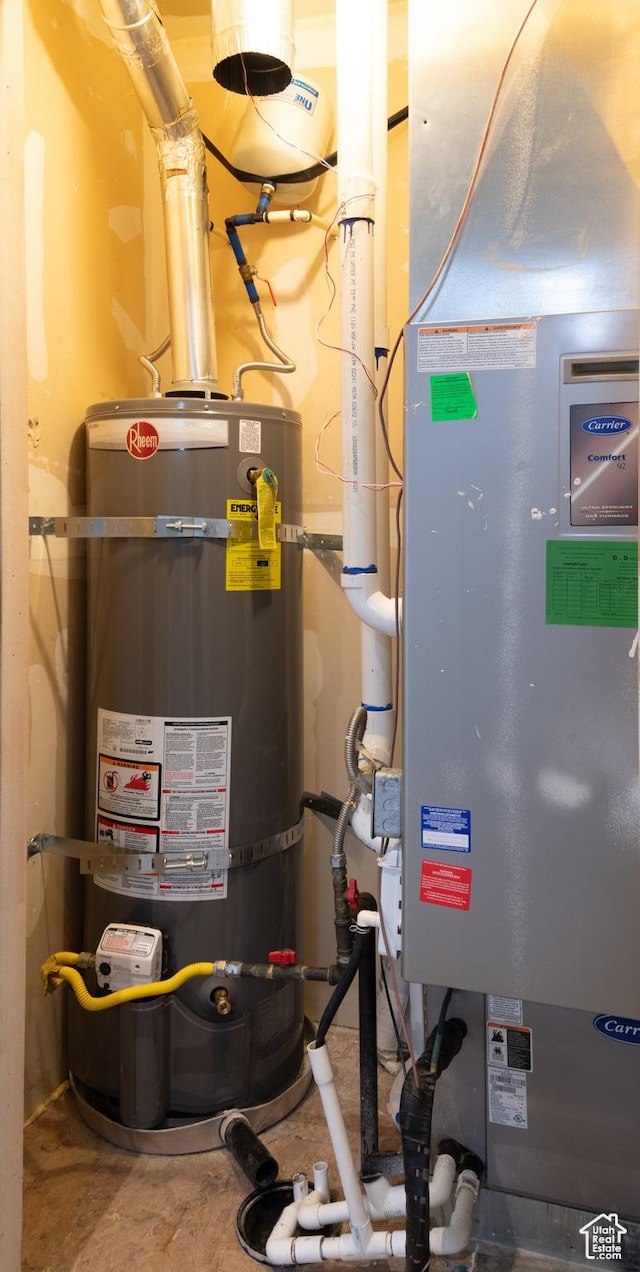 917 E Grape Ivy Way S, Millcreek, UT 84106 - utility room featuring strapped water heater and heating unit