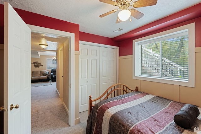 1516 N Willow Valley Dr W, Centerville, UT 84014 - carpeted bedroom with a textured ceiling, a closet, and ceiling fan