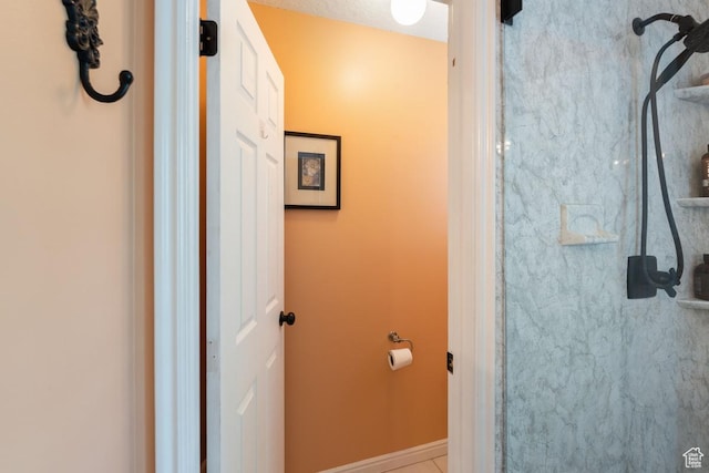 1516 N Willow Valley Dr W, Centerville, UT 84014 - bathroom with a shower, baseboards, and tile patterned floors