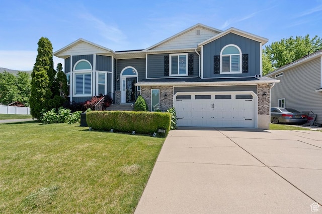 1516 N Willow Valley Dr W, Centerville, UT 84014 - view of front of house with a garage, concrete driveway, and a front yard