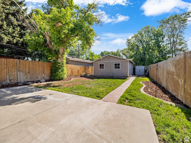 1067 S 400 E, Salt Lake City, UT 84111 - fenced backyard featuring a patio and an outbuilding