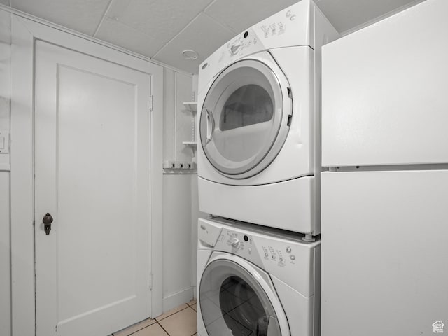 1067 S 400 E, Salt Lake City, UT 84111 - laundry room with estacked washer and dryer and light tile patterned floors