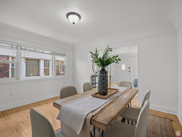 1067 S 400 E, Salt Lake City, UT 84111 - dining space with light wood-style flooring and a textured ceiling