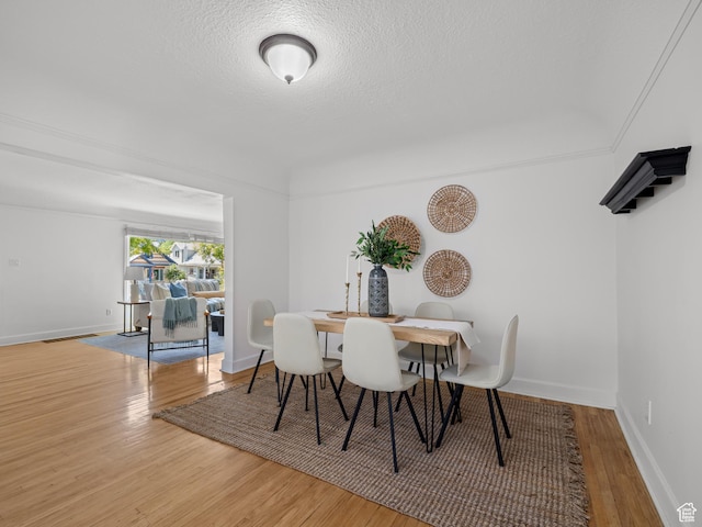 1067 S 400 E, Salt Lake City, UT 84111 - dining area with wood finished floors and a textured ceiling