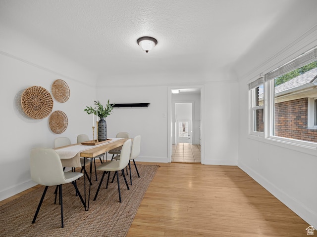 1067 S 400 E, Salt Lake City, UT 84111 - dining area with light wood finished floors and a textured ceiling