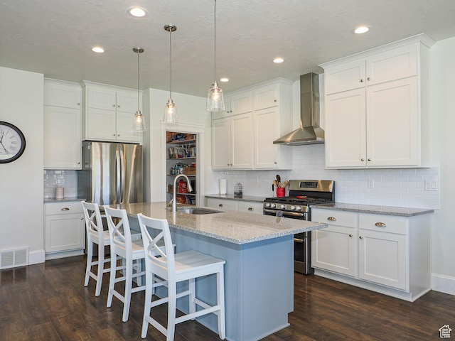 104 S Summer Breeze Ln W, Layton, UT 84041 - kitchen with stainless steel appliances, wall chimney exhaust hood, a sink, dark wood-style flooring, and recessed lighting