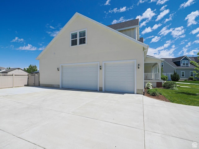 104 S Summer Breeze Ln W, Layton, UT 84041 - view of property exterior with concrete driveway, a garage, and stucco siding