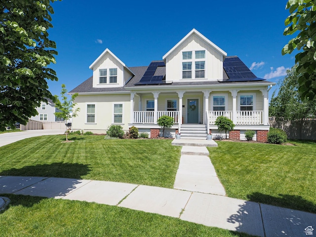 104 S Summer Breeze Ln W, Layton, UT 84041 - view of front of home featuring a porch, roof mounted solar panels, a shingled roof, and board and batten siding