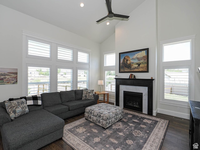 104 S Summer Breeze Ln W, Layton, UT 84041 - living room featuring high vaulted ceiling, dark wood-type flooring, a ceiling fan, a premium fireplace, and baseboards