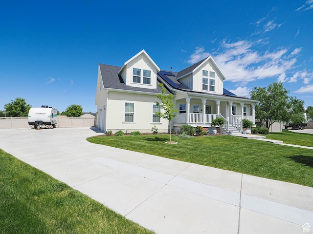 104 S Summer Breeze Ln W, Layton, UT 84041 - view of front of property with a porch, roof mounted solar panels, driveway, and a garage