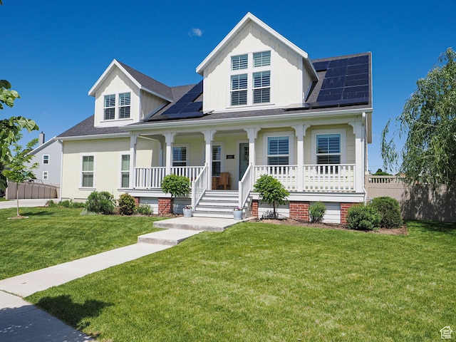 104 S Summer Breeze Ln W, Layton, UT 84041 - view of front of home featuring a porch, roof mounted solar panels, roof with shingles, and board and batten siding