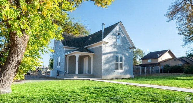 59 E 300 N, Ephraim, UT 84627 - view of front facade featuring a front lawn and stucco siding
