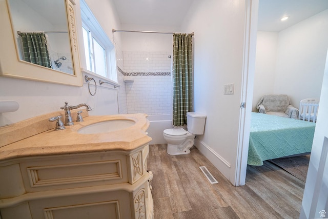 59 E 300 N, Ephraim, UT 84627 - full bath featuring wood finished floors, toilet, shower / tub combo with curtain, vanity, and baseboards