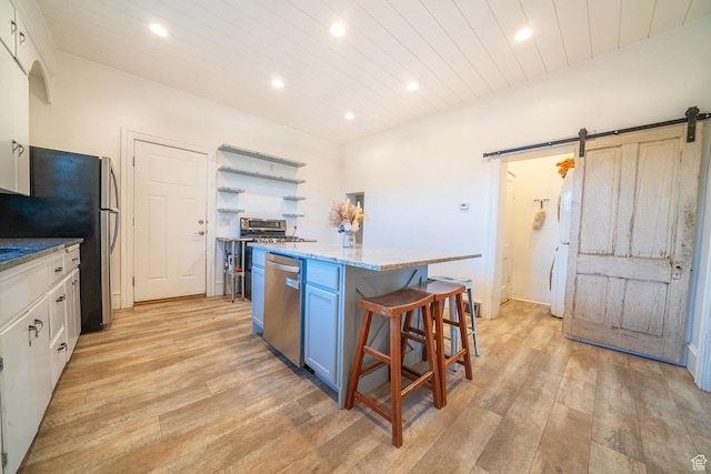 59 E 300 N, Ephraim, UT 84627 - kitchen with stainless steel appliances, recessed lighting, a barn door, light wood-style flooring, and a kitchen island