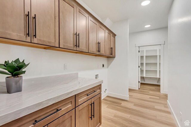 864 S 1260 W Unit 129, Heber City, UT 84032 - laundry area featuring electric dryer hookup, recessed lighting, light wood-style floors, cabinet space, and baseboards