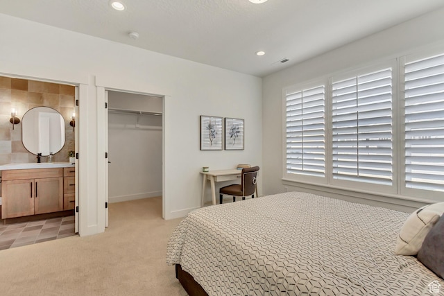 864 S 1260 W Unit 129, Heber City, UT 84032 - bedroom featuring a spacious closet, recessed lighting, a closet, light colored carpet, and connected bathroom