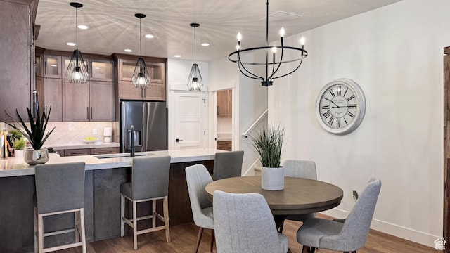 864 S 1260 W Unit 129, Heber City, UT 84032 - dining space featuring wood finished floors, a chandelier, baseboards, and recessed lighting