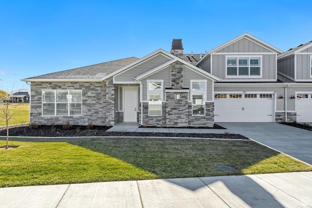 864 S 1260 W Unit 129, Heber City, UT 84032 - view of front of property with stone siding, concrete driveway, an attached garage, a front lawn, and board and batten siding