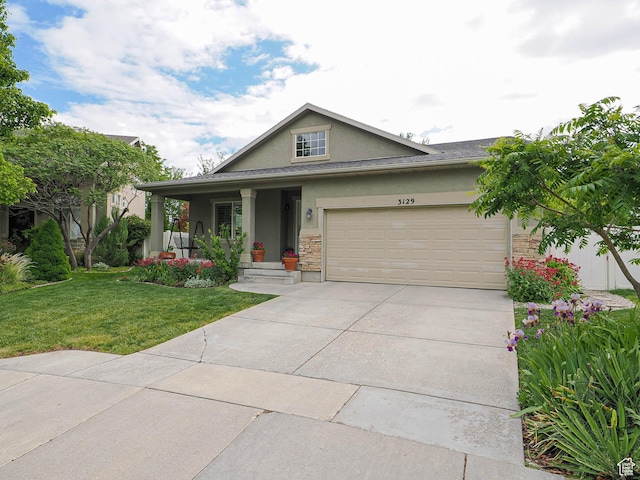 3129 S Eagle Rock Way W, West Valley City, UT 84120 - view of front facade featuring stucco siding, a front yard, concrete driveway, a garage, and stone siding