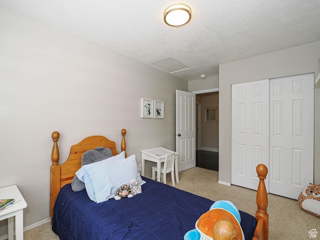 3129 S Eagle Rock Way W, West Valley City, UT 84120 - bedroom featuring attic access, carpet floors, baseboards, a closet, and a textured ceiling