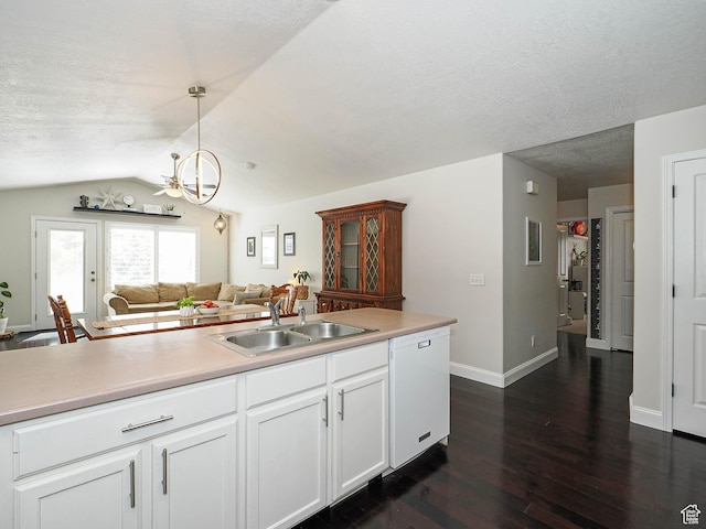 3129 S Eagle Rock Way W, West Valley City, UT 84120 - kitchen with dishwasher, a sink, dark wood-style floors, lofted ceiling, and a chandelier