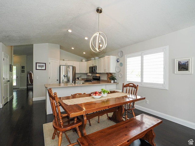 3129 S Eagle Rock Way W, West Valley City, UT 84120 - dining space with vaulted ceiling, dark wood-type flooring, baseboards, recessed lighting, and a chandelier
