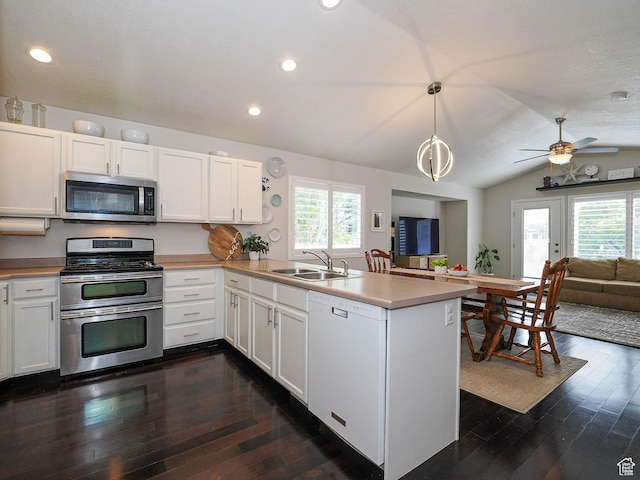 3129 S Eagle Rock Way W, West Valley City, UT 84120 - kitchen featuring appliances with stainless steel finishes, a sink, open floor plan, a peninsula, and plenty of natural light