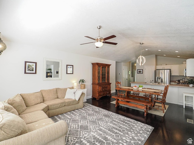 3129 S Eagle Rock Way W, West Valley City, UT 84120 - living room with vaulted ceiling, ceiling fan, dark wood finished floors, and recessed lighting