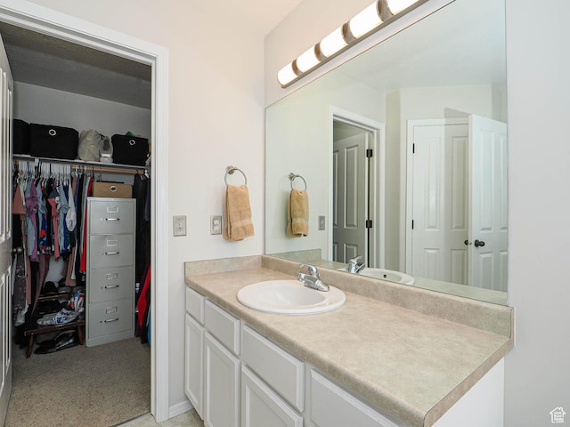 3129 S Eagle Rock Way W, West Valley City, UT 84120 - bathroom featuring vanity and a spacious closet