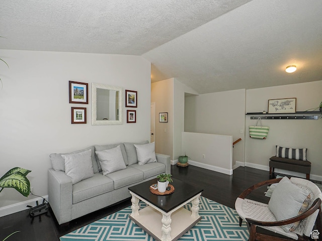 3129 S Eagle Rock Way W, West Valley City, UT 84120 - living area with wood finished floors, vaulted ceiling, baseboards, and a textured ceiling
