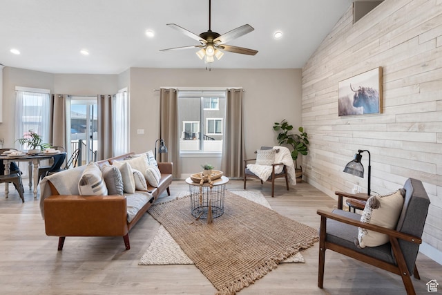 4957 N Sage Dr, Eagle Mountain, UT 84005 - living area featuring a ceiling fan, wood walls, light wood-style flooring, recessed lighting, and lofted ceiling