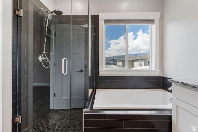 4957 N Sage Dr, Eagle Mountain, UT 84005 - full bathroom with a shower stall, a garden tub, and vanity