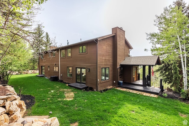 7189 N Hitching Post Dr W, Park City, UT 84098 - back of property featuring a chimney, a lawn, and cooling unit