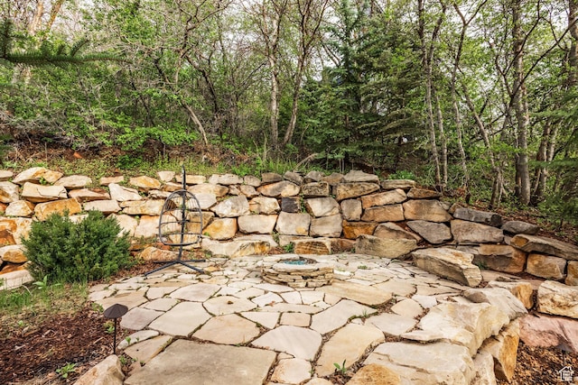 7189 N Hitching Post Dr W, Park City, UT 84098 - view of patio / terrace with an outdoor fire pit