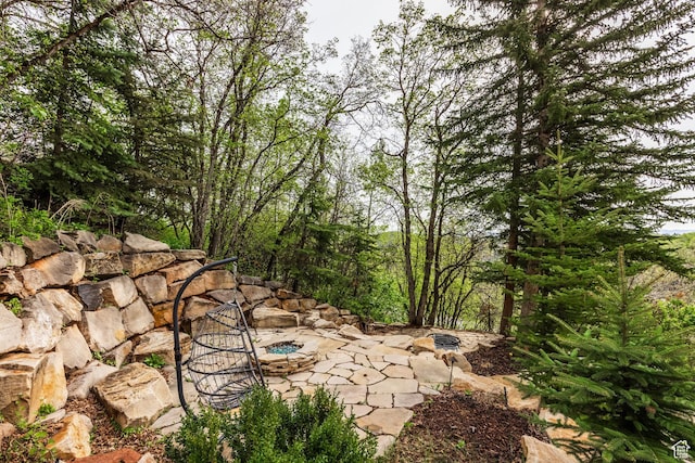 7189 N Hitching Post Dr W, Park City, UT 84098 - view of yard with a fire pit and a patio area