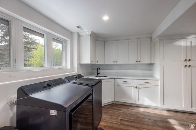 7189 N Hitching Post Dr W, Park City, UT 84098 - laundry area with washing machine and dryer, plenty of natural light, cabinet space, dark wood finished floors, and recessed lighting