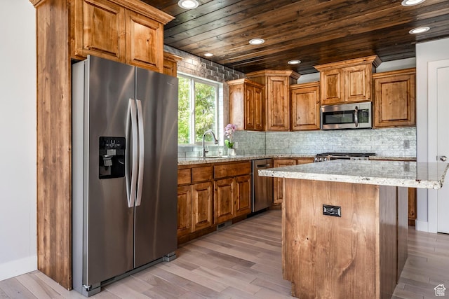 3824 N Patiosprings Dr, Eden, UT 84310 - kitchen with stainless steel appliances, brown cabinets, wood ceiling, a sink, and light wood-type flooring